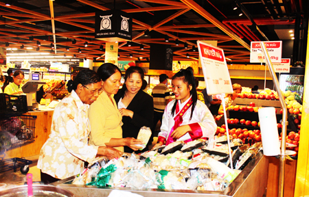 Customers buying products at Lotte Mart.