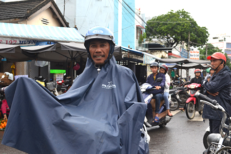 Pham Ngoc Hung (aged 51) works as motorbike driver for over 20 years. Hung says that the days prior to Tet are his busiest time in a year. 