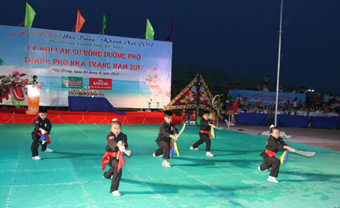 Performing traditional martial art.