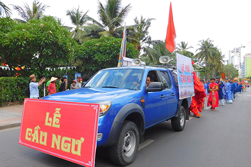 Propaganda car leads procession.