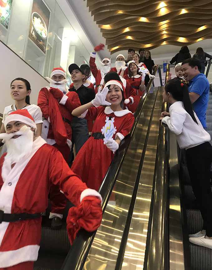 People dressed as Santa Claus at Nha Trang Center