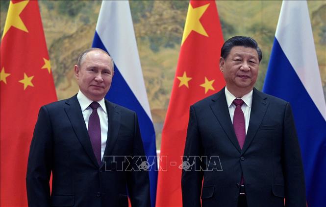 Tổng thống Nga Vladimir Putin (trái) và Chủ tịch Trung Quốc Tập Cận Bình tại cuộc gặp ở Bắc Kinh, ngày 4/2/2022. Ảnh (tư liệu): AFP/TTXVN